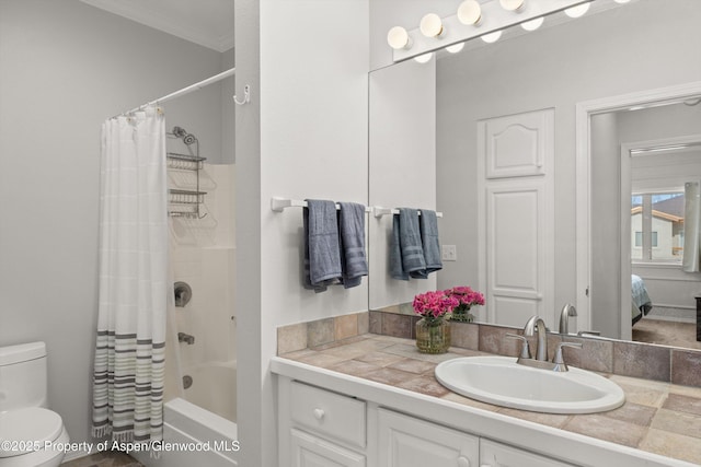 full bathroom with ornamental molding, vanity, shower / tub combo with curtain, and toilet