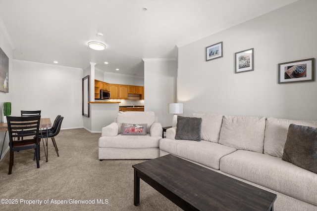 carpeted living room with crown molding