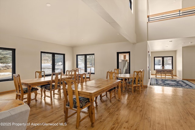 dining space featuring light hardwood / wood-style flooring and french doors