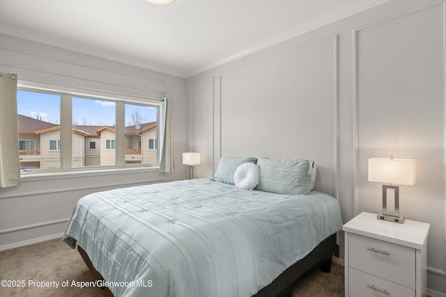 bedroom featuring crown molding and carpet flooring