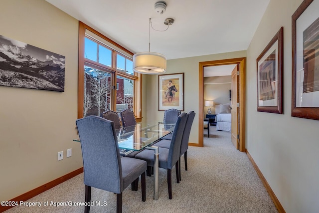 view of carpeted dining area