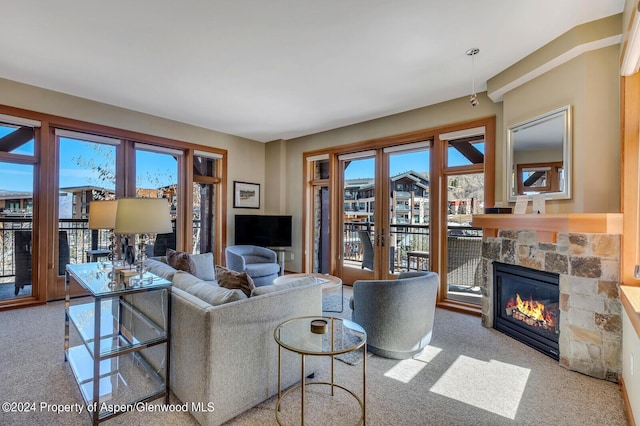 carpeted living room featuring a fireplace