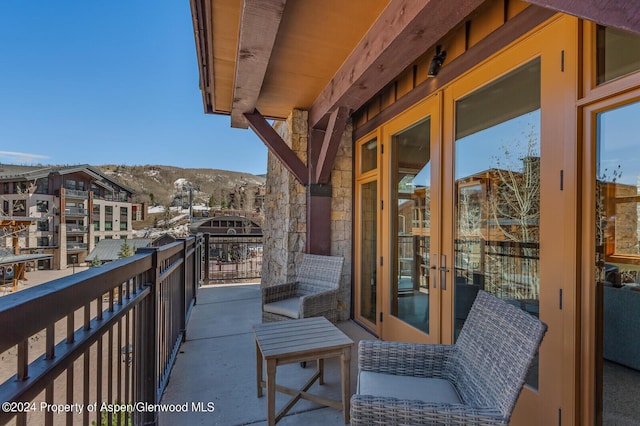 balcony featuring a mountain view