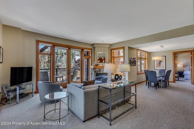 carpeted living room featuring a fireplace