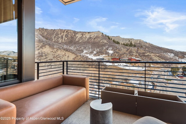 balcony featuring a mountain view