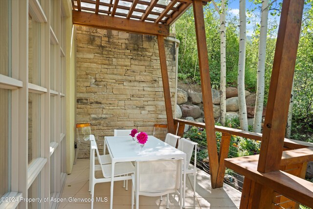 250 Mountain Laurel Dr Unit B, Aspen, CO 81611 - wooden terrace featuring outdoor dining space