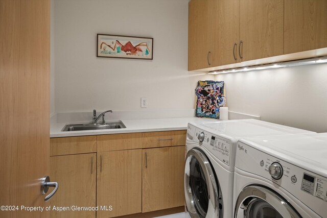 250 Mountain Laurel Dr Unit B, Aspen, CO 81611 - washroom featuring washing machine and clothes dryer and cabinet space