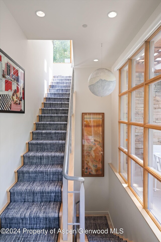 250 Mountain Laurel Dr Unit B, Aspen, CO 81611 - staircase featuring baseboards and recessed lighting