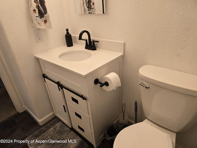 bathroom with vanity and toilet