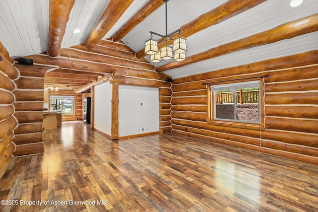 1116 Walz Ave, Glenwood Springs, CO 81601 - unfurnished living room with hardwood / wood-style flooring and log walls