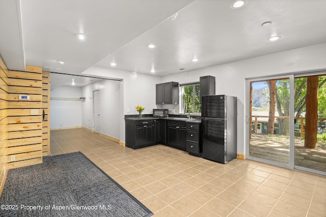 1116 Walz Ave, Glenwood Springs, CO 81601 - kitchen with black appliances, light tile patterned floors, recessed lighting, a sink, and baseboards