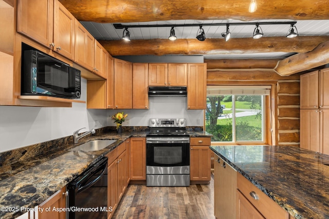 1116 Walz Ave, Glenwood Springs, CO 81601 - kitchen featuring black appliances, under cabinet range hood, rustic walls, a sink, and wood finished floors