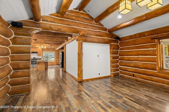 1116 Walz Ave, Glenwood Springs, CO 81601 - unfurnished living room featuring dark wood finished floors, log walls, and baseboards