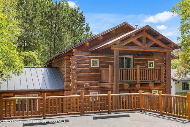 1116 Walz Ave, Glenwood Springs, CO 81601 - rear view of property with log siding, a balcony, a standing seam roof, and metal roof