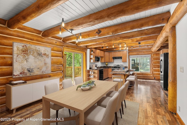 1116 Walz Ave, Glenwood Springs, CO 81601 - dining room with hardwood / wood-style flooring, wood ceiling with exposed beams, and log walls
