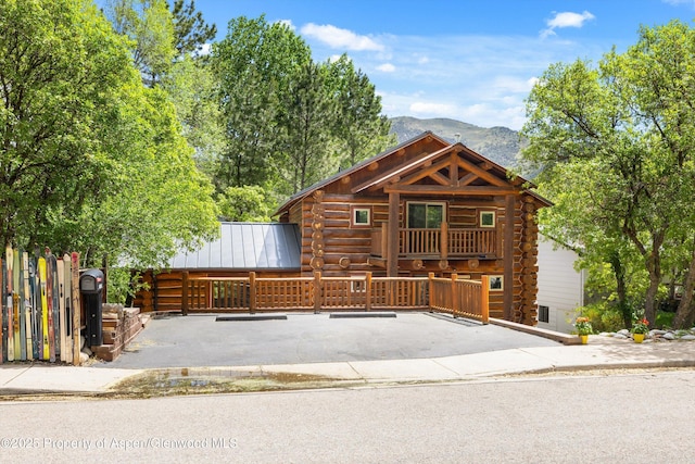 1116 Walz Ave, Glenwood Springs, CO 81601 - cabin with log siding, a mountain view, and uncovered parking