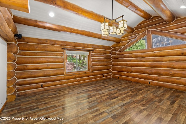 1116 Walz Ave, Glenwood Springs, CO 81601 - empty room featuring dark wood-type flooring, plenty of natural light, rustic walls, and recessed lighting