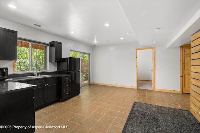 1116 Walz Ave, Glenwood Springs, CO 81601 - kitchen featuring a sink, black appliances, dark cabinetry, recessed lighting, and dark stone countertops