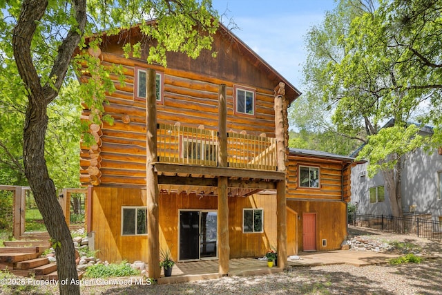 1116 Walz Ave, Glenwood Springs, CO 81601 - back of house with log siding, a deck, and a patio