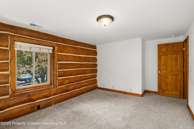 1116 Walz Ave, Glenwood Springs, CO 81601 - unfurnished room with log walls, baseboards, and carpet