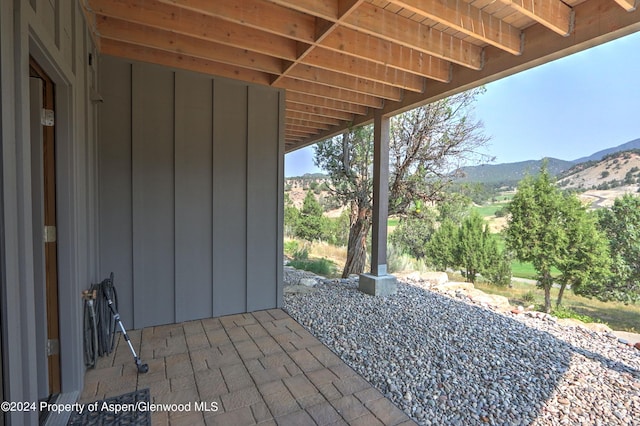 view of patio / terrace with a mountain view