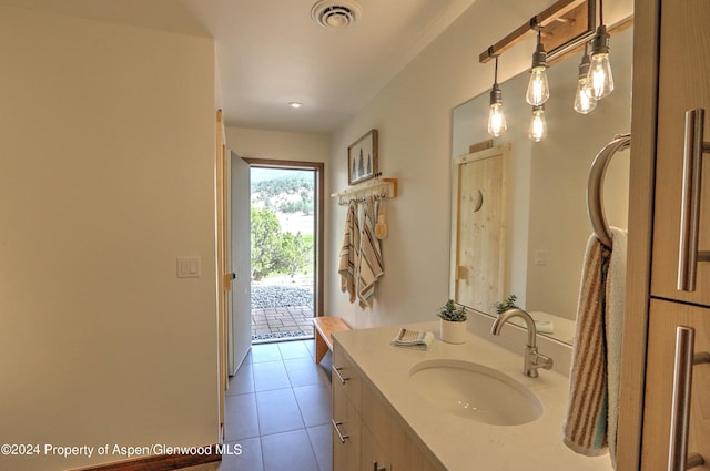 bathroom featuring tile patterned floors and vanity