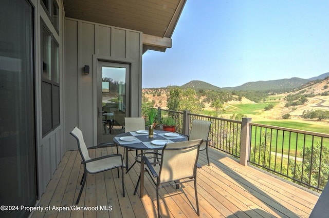 wooden terrace featuring a mountain view