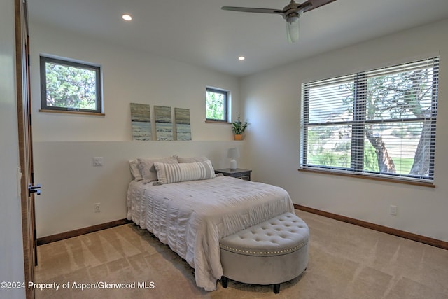 carpeted bedroom with ceiling fan