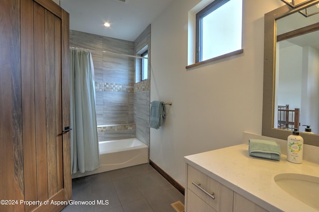 bathroom with tile patterned flooring, vanity, and shower / tub combo with curtain