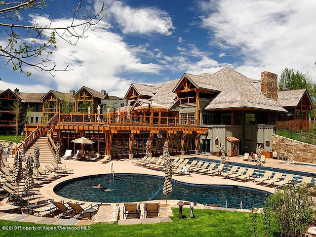 view of swimming pool with a patio area