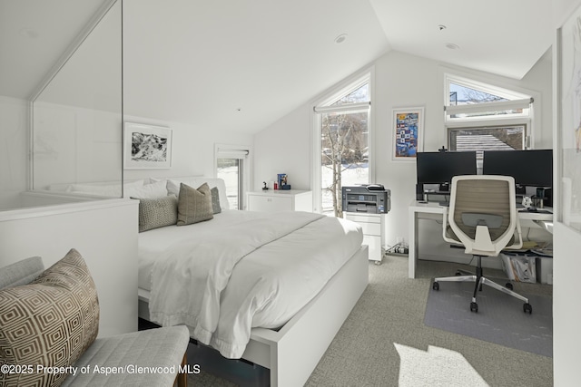 carpeted bedroom featuring multiple windows and vaulted ceiling