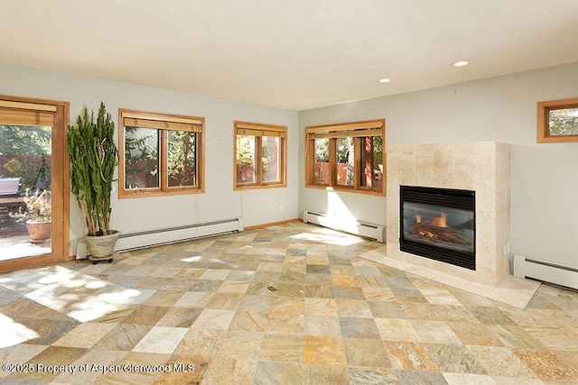 311 Midland Ave, Aspen, CO 81611 - unfurnished living room featuring baseboard heating, a baseboard heating unit, a tile fireplace, recessed lighting, and stone finish flooring