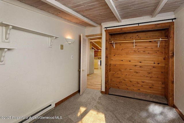 311 Midland Ave, Aspen, CO 81611 - unfurnished bedroom featuring carpet, wooden ceiling with exposed beams, and baseboards
