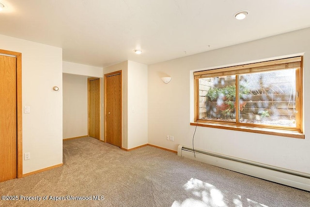 311 Midland Ave, Aspen, CO 81611 - unfurnished room with a baseboard radiator, light colored carpet, baseboards, and recessed lighting