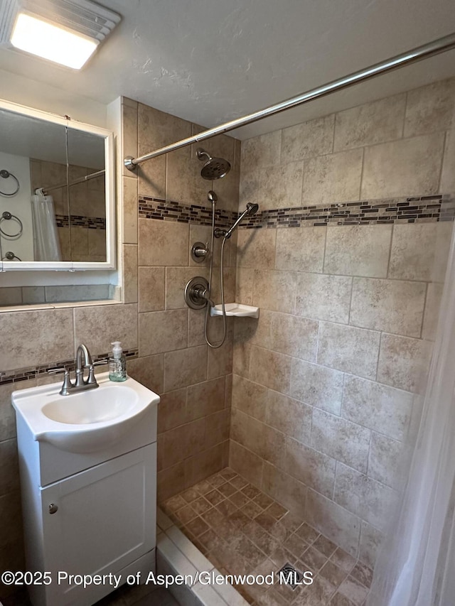 890 Breeze St, Craig, CO 81625 - bathroom featuring a tile shower and vanity