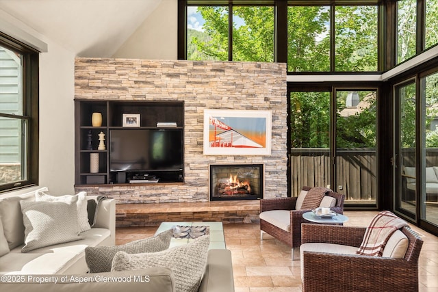 939 E Cooper Ave, Aspen, CO 81611 - living area featuring a fireplace and a towering ceiling