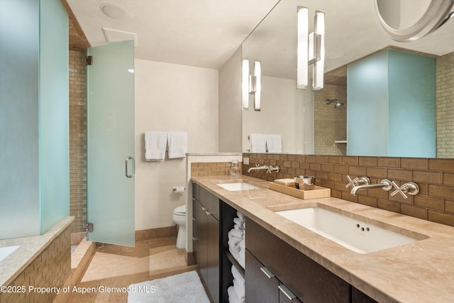 939 E Cooper Ave, Aspen, CO 81611 - bathroom with a shower stall, tasteful backsplash, and double vanity