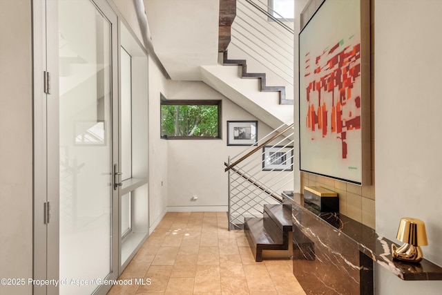 939 E Cooper Ave, Aspen, CO 81611 - entrance foyer with stairway and light tile patterned floors