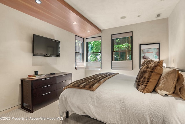 939 E Cooper Ave, Aspen, CO 81611 - bedroom with light carpet, vaulted ceiling, and recessed lighting