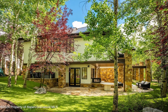 back of house with french doors, a yard, and a patio area