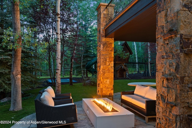 view of patio / terrace with a fire pit