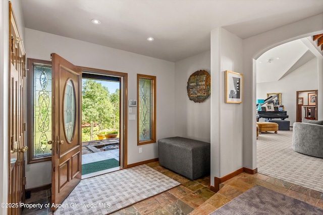 477 Aspen Oak Dr, Aspen, CO 81611 - entryway featuring stone tile flooring, recessed lighting, and arched walkways