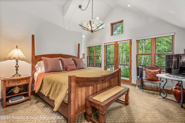 477 Aspen Oak Dr, Aspen, CO 81611 - carpeted bedroom featuring high vaulted ceiling, a chandelier, and access to exterior