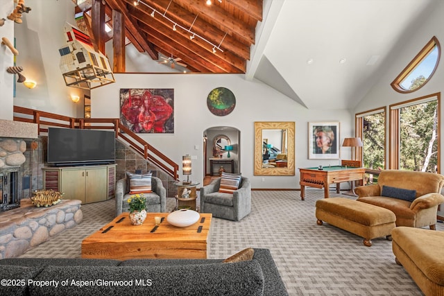 477 Aspen Oak Dr, Aspen, CO 81611 - living room with carpet, high vaulted ceiling, pool table, arched walkways, and a fireplace
