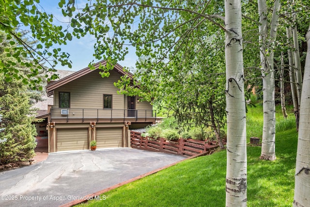 477 Aspen Oak Dr, Aspen, CO 81611 - rustic home with driveway, a garage, and a front lawn