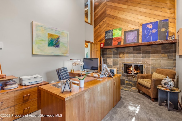 477 Aspen Oak Dr, Aspen, CO 81611 - carpeted office with a fireplace, high vaulted ceiling, and wood walls