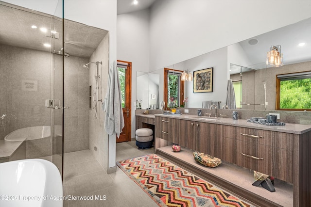 477 Aspen Oak Dr, Aspen, CO 81611 - bathroom with a stall shower, a freestanding bath, vanity, recessed lighting, and tile patterned floors