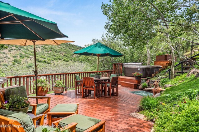 477 Aspen Oak Dr, Aspen, CO 81611 - wooden terrace featuring a hot tub and outdoor dining space