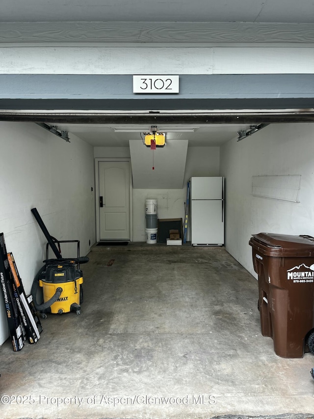 3102 Elk Ln, Basalt, CO 81621 - garage with freestanding refrigerator and a garage door opener