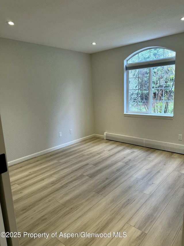 3102 Elk Ln, Basalt, CO 81621 - unfurnished room featuring recessed lighting, baseboards, a baseboard heating unit, and light wood finished floors